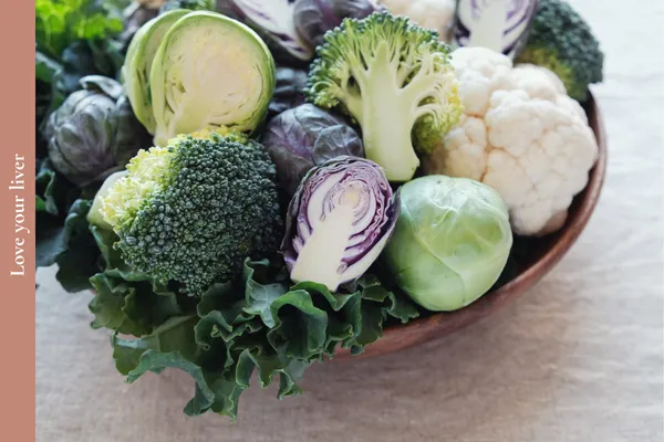 Colourful selection of liver-supporting foods including leafy greens, broccoli, brussel sprouts and cauliflower to promote healthy ageing, energy and wellbeing in midlife.
