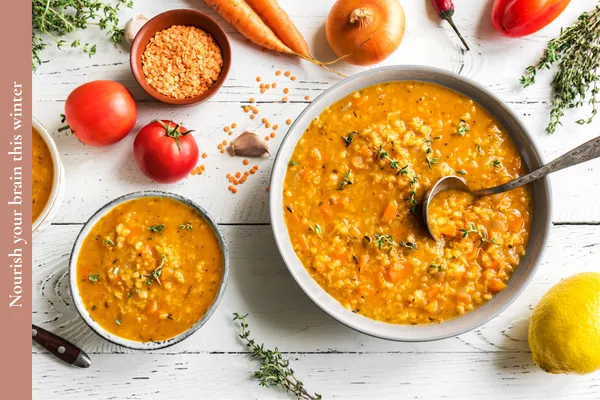 Warm lentil soup in a bowl, a nourishing winter meal rich in protein and fiber to support brain health and steady energy.