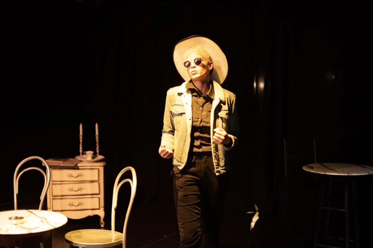 stormetheplay. Stormy in her signature cowboy hat, boots, aviator shades, and gun holster.