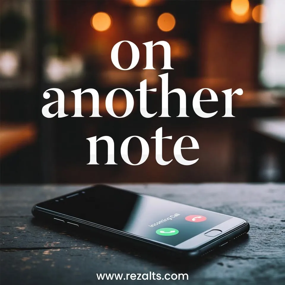 Ringing phone on wooden table 