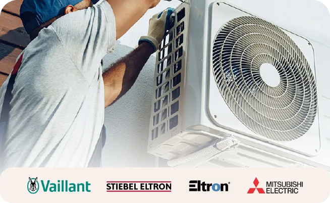 Engineer installing an air source heat pump 