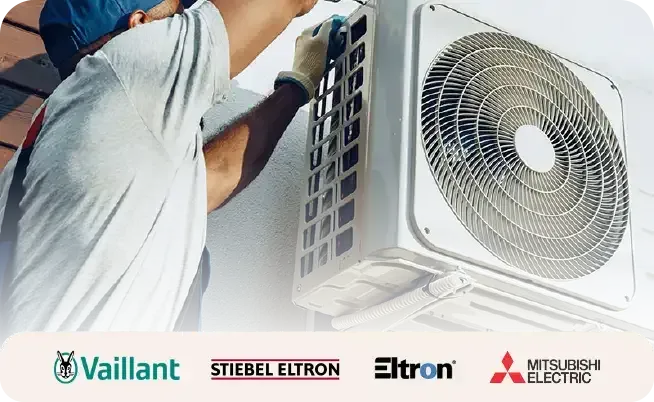 Engineer installing an air source heat pump