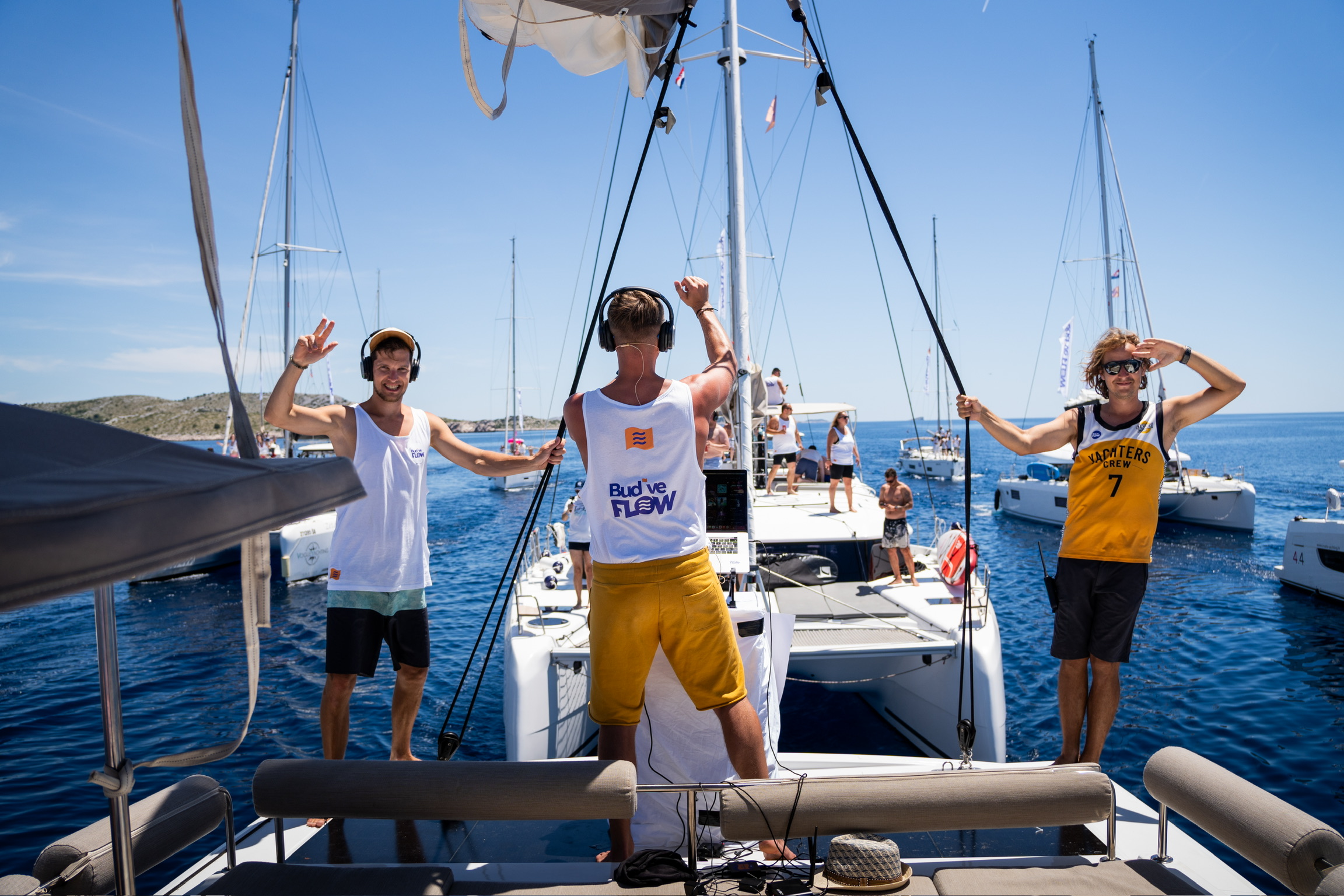 Bright premium event photo, clean composition, people smiling with silent disco headphones, natural daylight, modern, airy.
