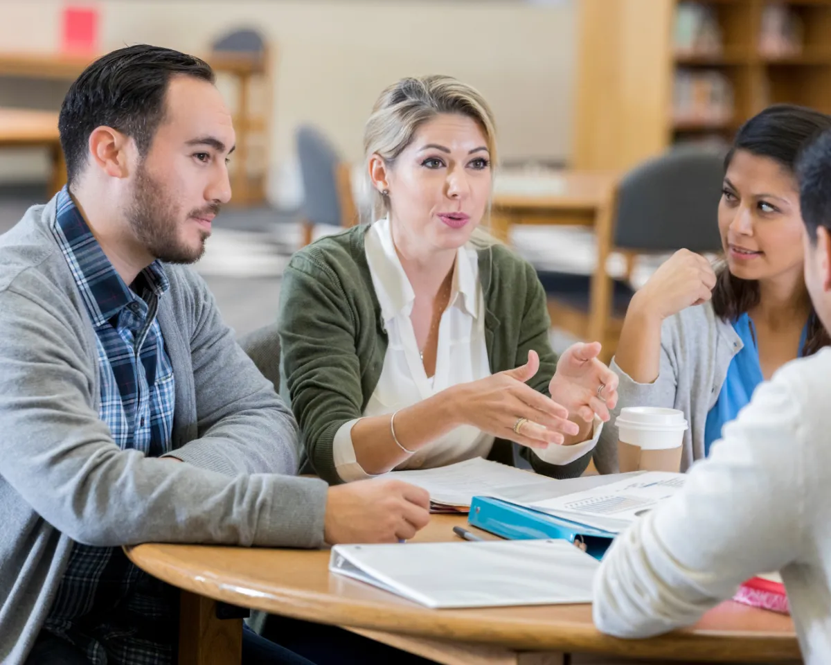 green linear plant in clear drinking glass