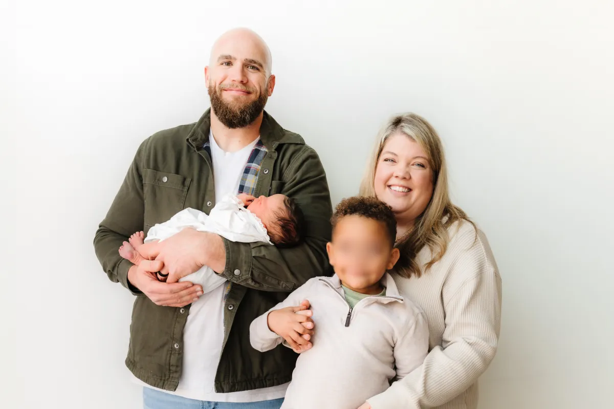 Children and adoptive family together in community