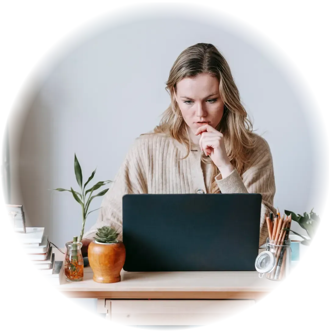 female doing health insurance research on laptop