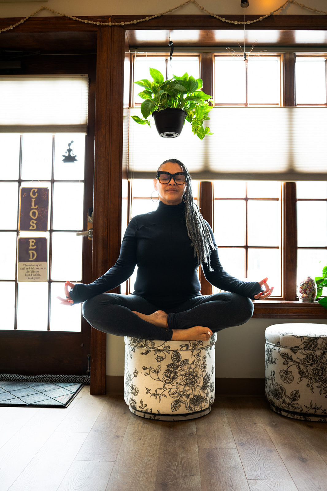 MamaTee Wellness empty yoga studio space bathed in warm natural light