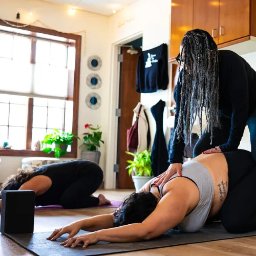 MamaTee Wellness empty yoga studio space bathed in warm natural light