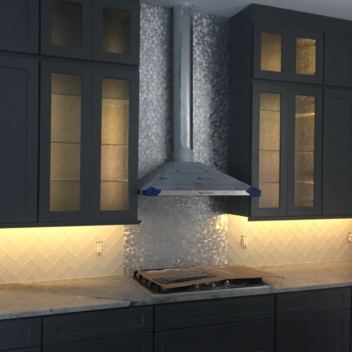 Elegant bathroom remodel with freestanding tub, large vanity, gold fixtures, and walk-in glass shower.