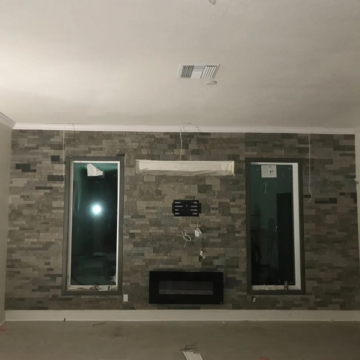 Newly built two-story suburban home with attached garage and fresh sod landscaping.
