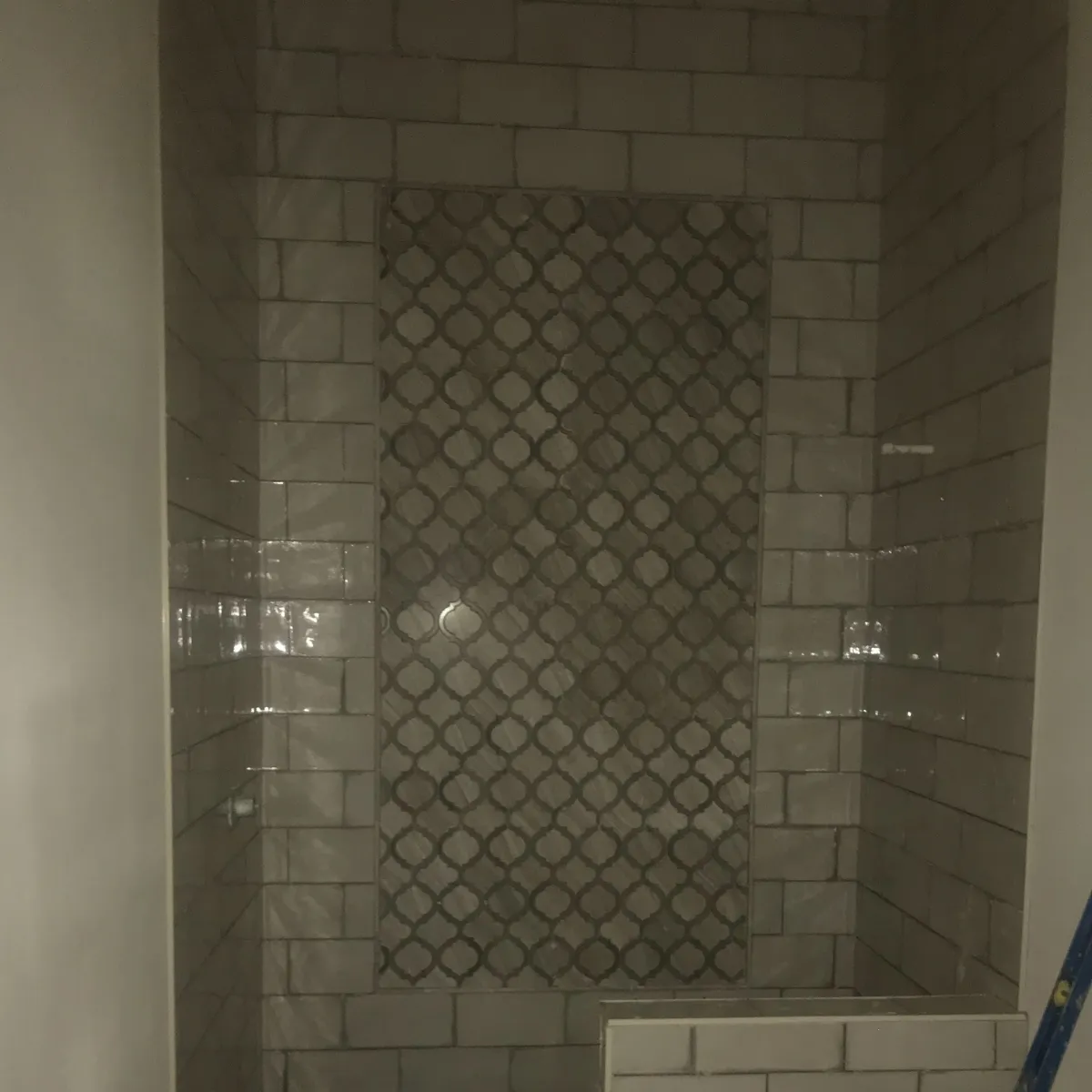 Elegant bathroom remodel with freestanding tub, large vanity, gold fixtures, and walk-in glass shower.