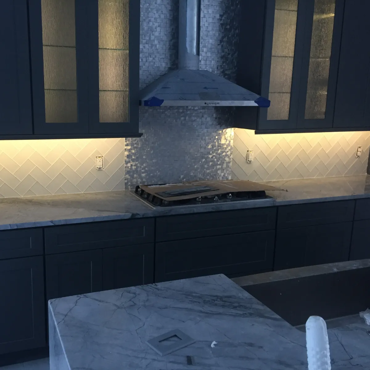 Elegant bathroom remodel with freestanding tub, large vanity, gold fixtures, and walk-in glass shower.