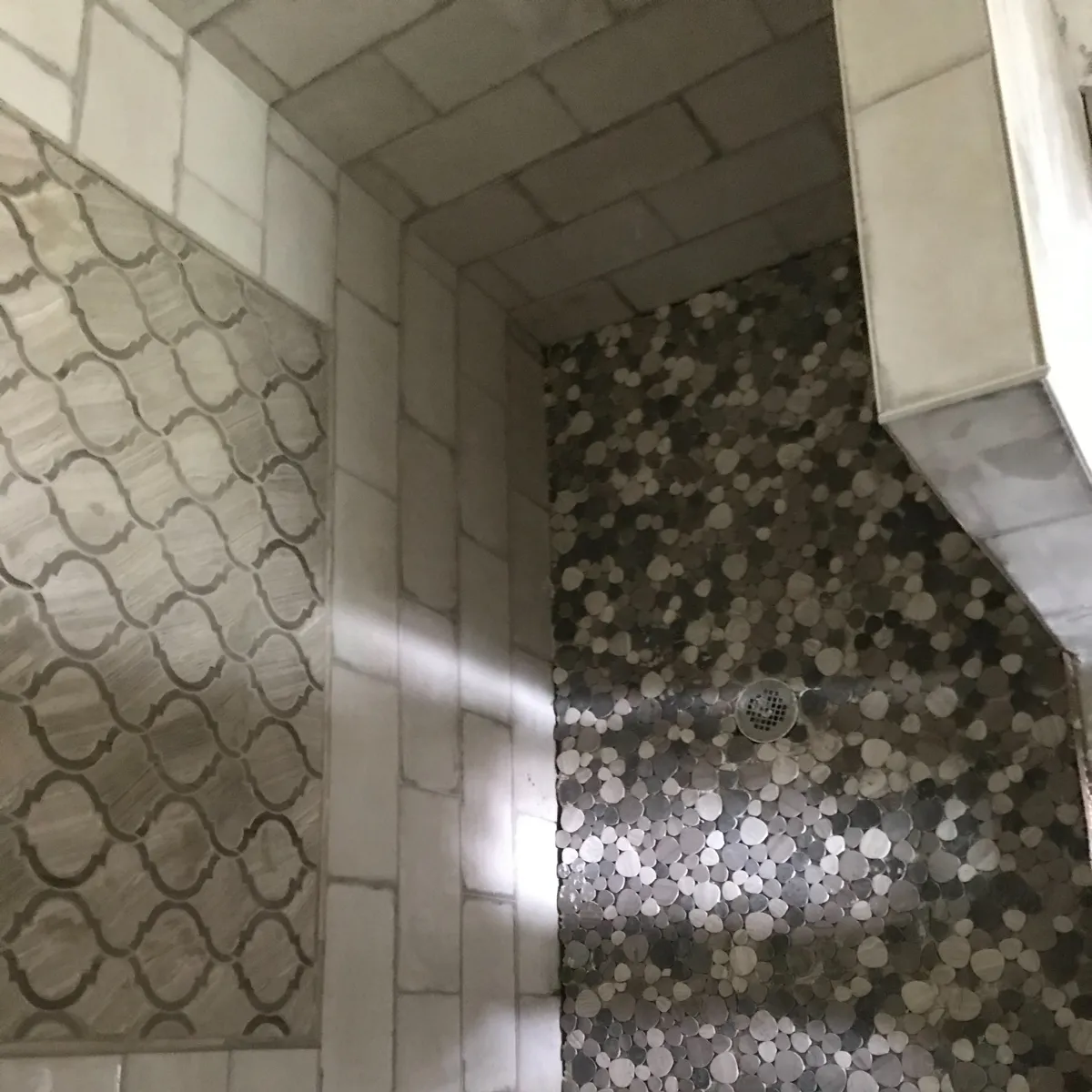 Elegant bathroom remodel with freestanding tub, large vanity, gold fixtures, and walk-in glass shower.