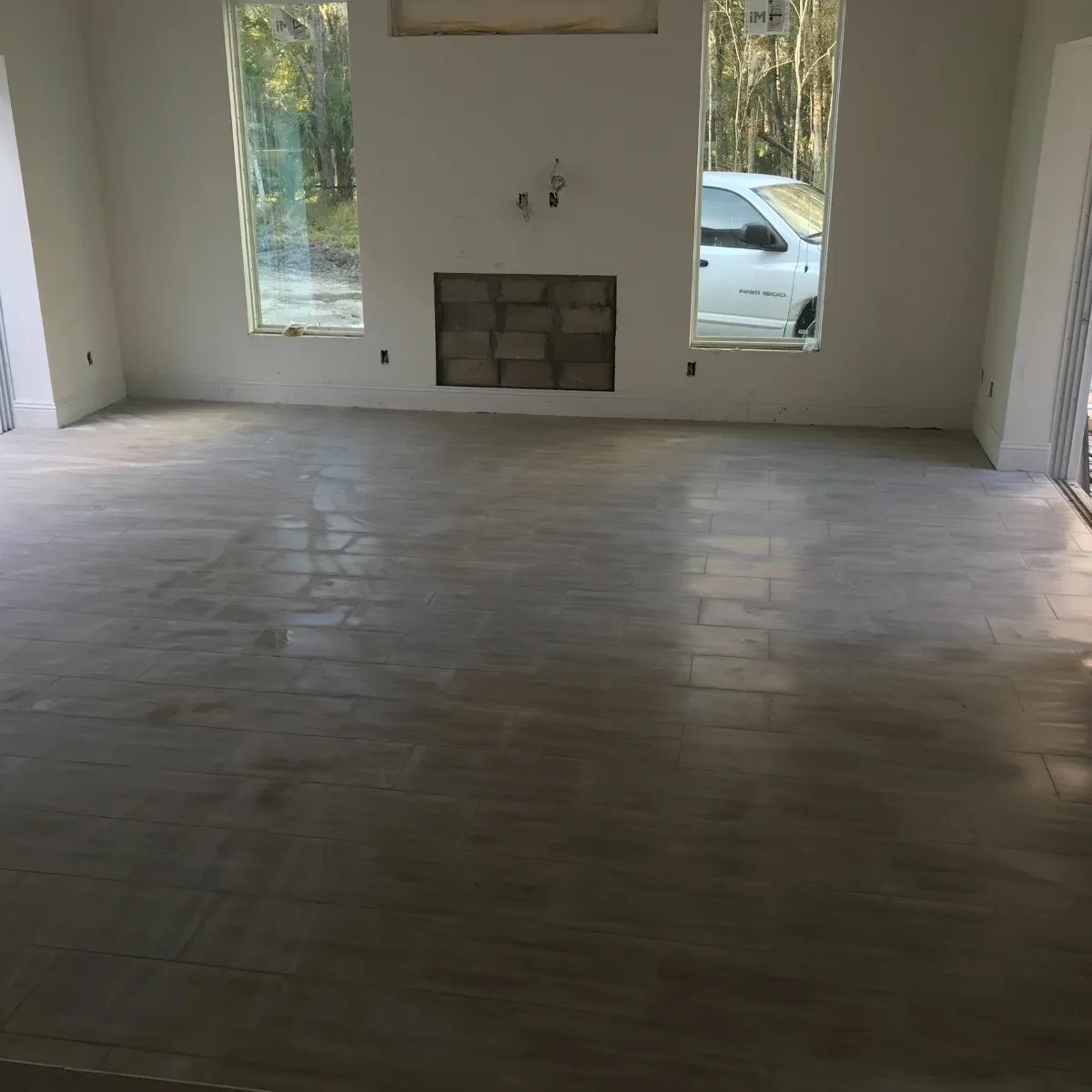 Newly built two-story suburban home with attached garage and fresh sod landscaping.
