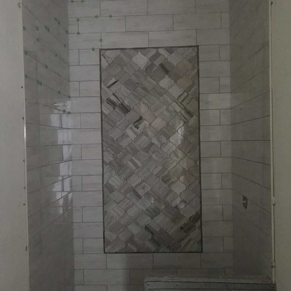 Elegant bathroom remodel with freestanding tub, large vanity, gold fixtures, and walk-in glass shower.
