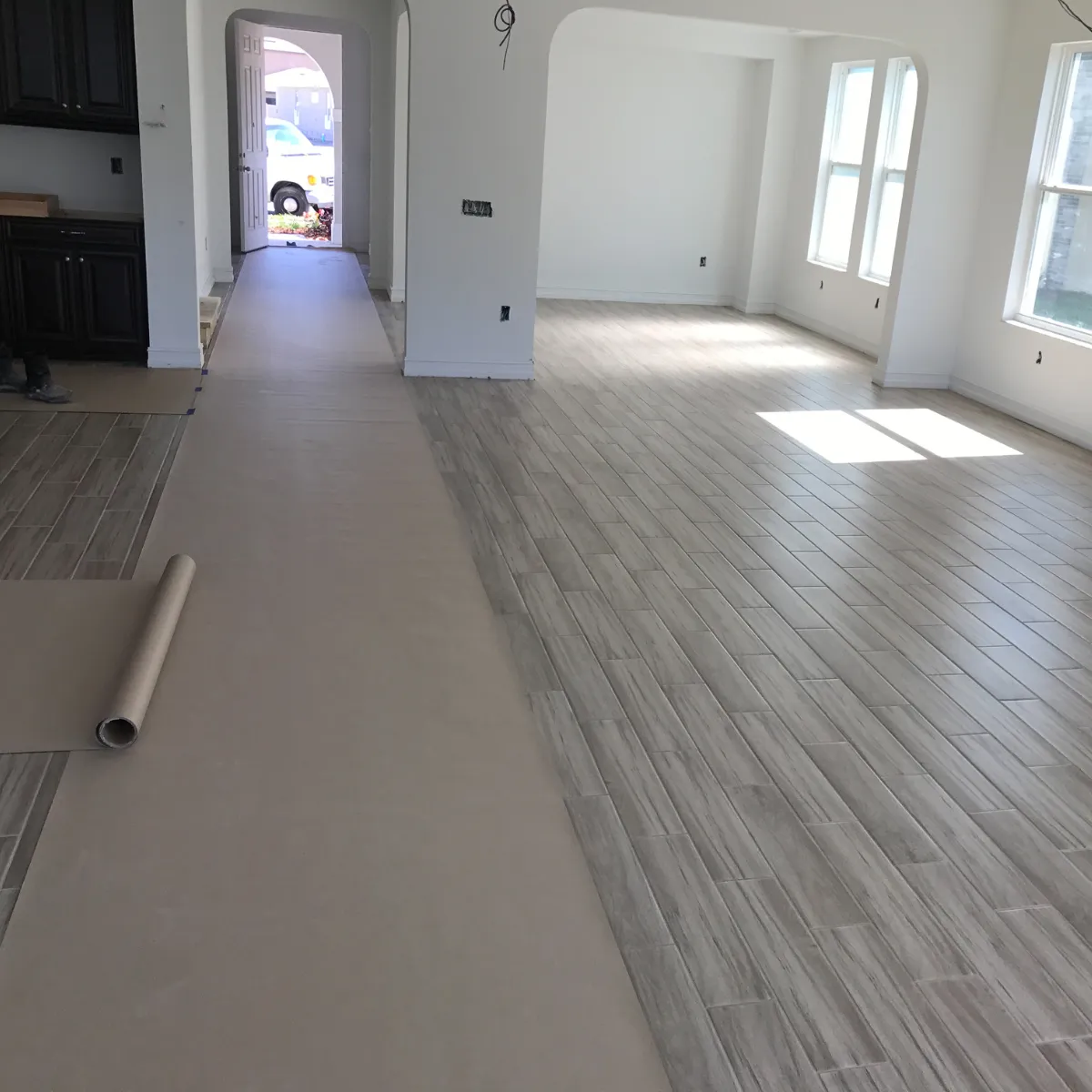 Newly built two-story suburban home with attached garage and fresh sod landscaping.