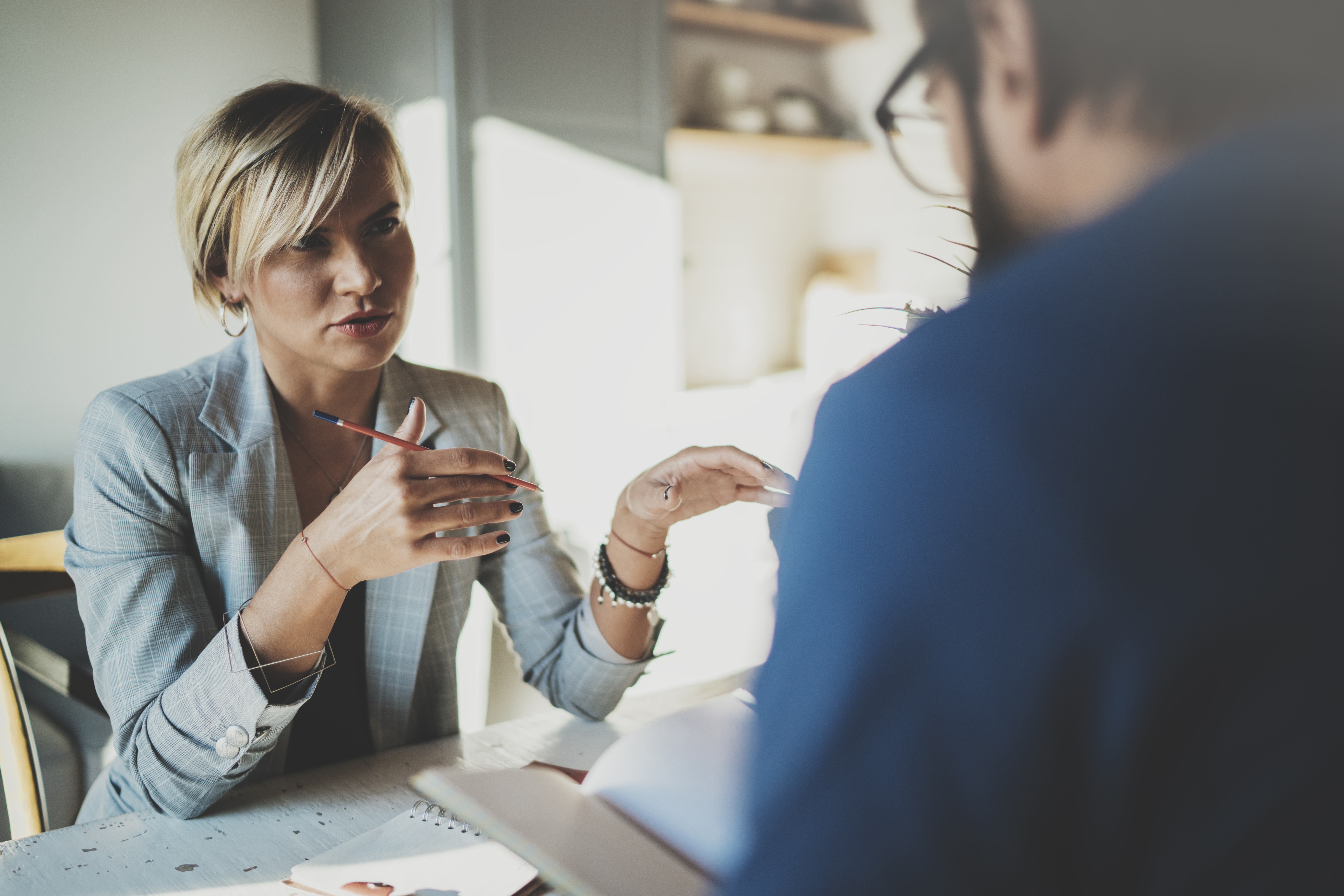 One-on-one business coaching session between an Evolve ActionCOACH coach and a business owner