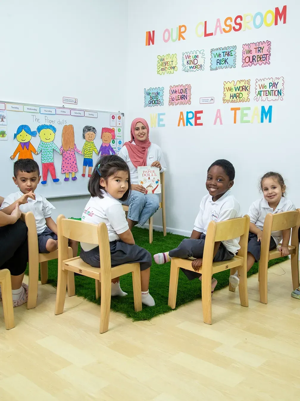 Image Shows A Teacher With Children At Gardenia Nursery
