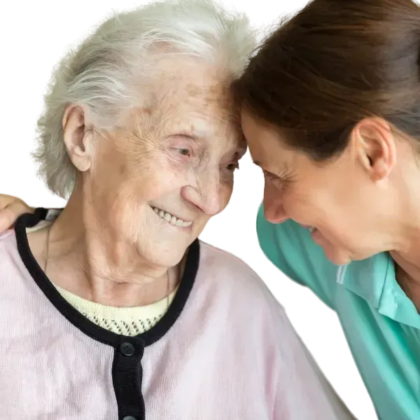 Compassionate caregiver supporting elderly woman at home