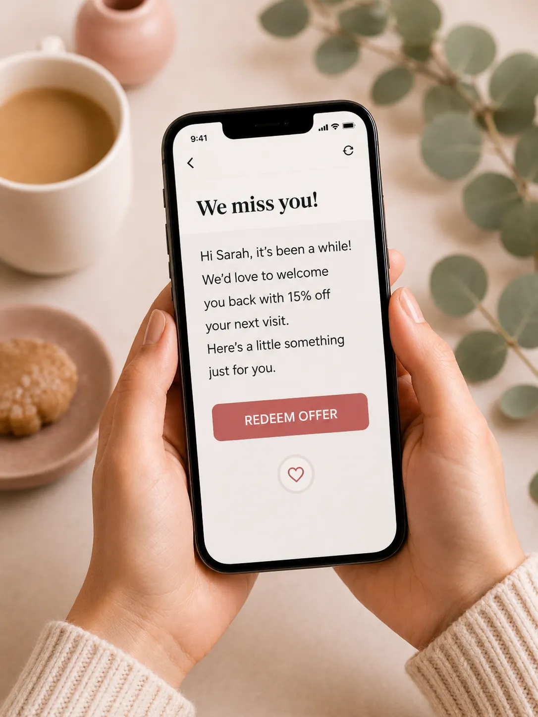 Woman holding phone with customer reactivation offer message for database reactivation campaign