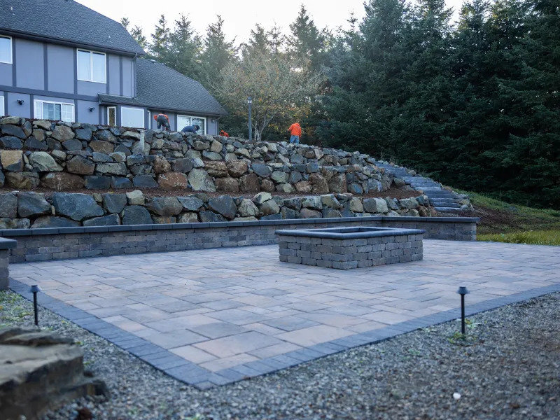 stone patio with rectangle fire pit