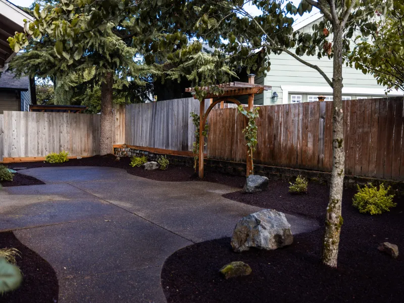fenced landscaped back patio area