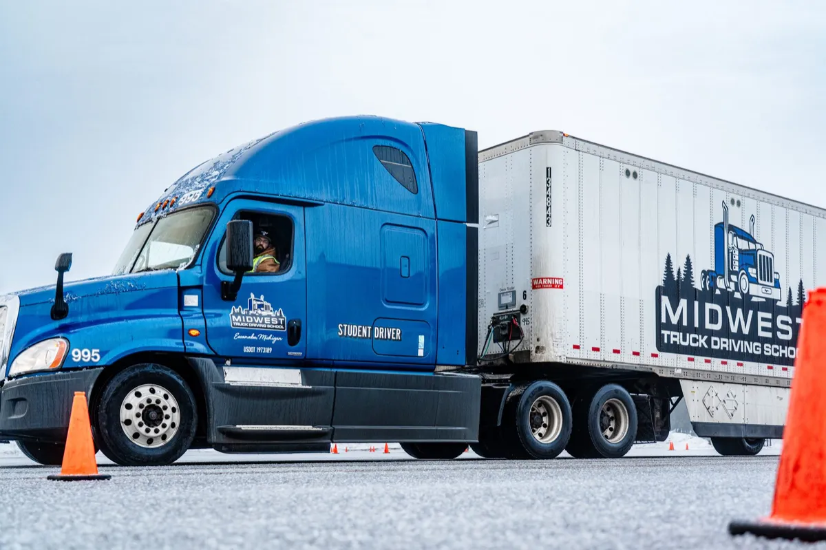 Student driving a Midwest tractor trailer on the training range