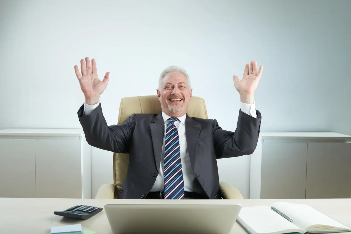 Business professional celebrating success and growth at the office.