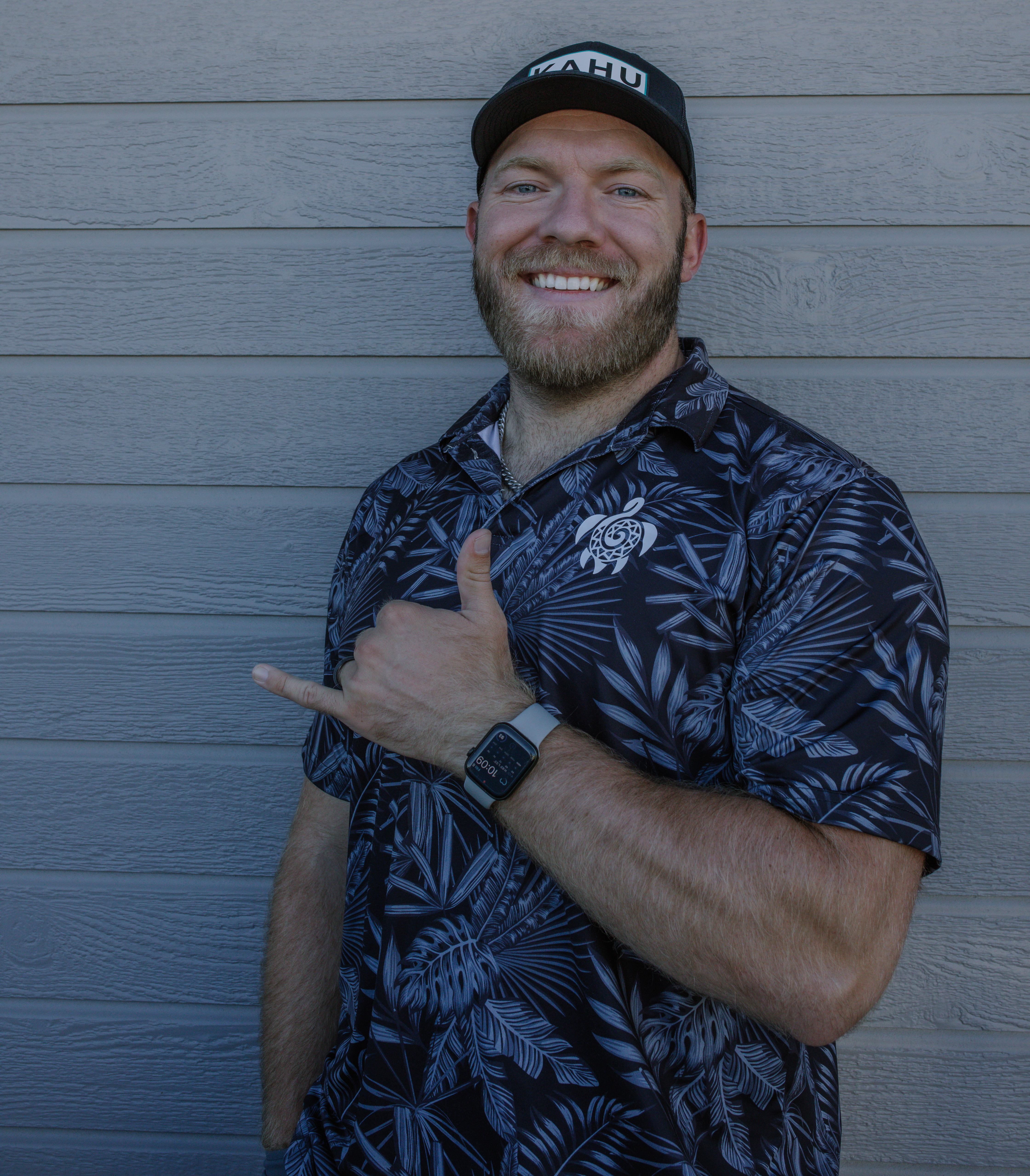 A young professional, Jordan, standing confidently in front of a whiteboard filled with sales charts, smiling and holding a 'Top Performer' award. The office is modern, with plants and motivational posters.