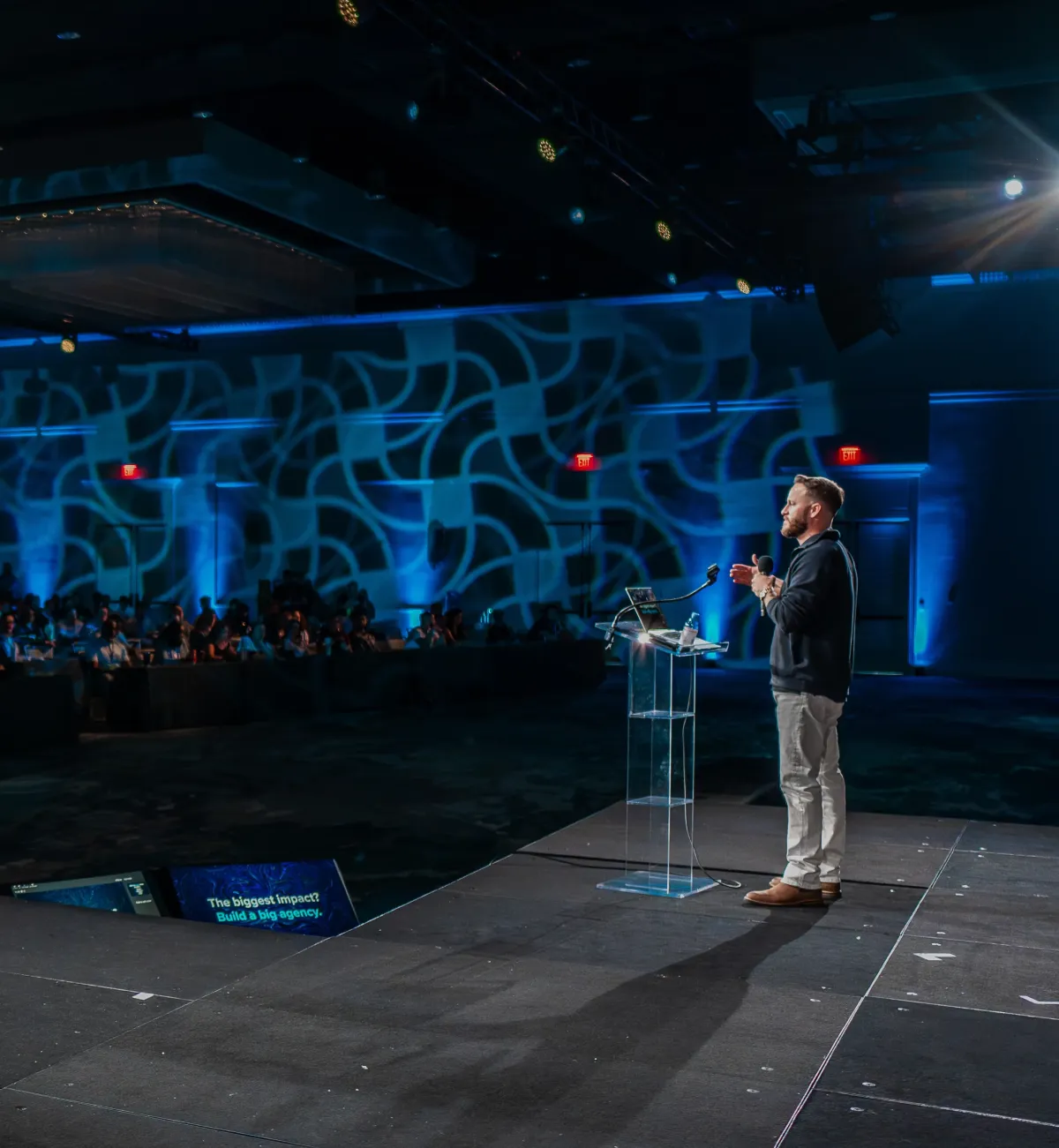 Justin Brock speaking on stage