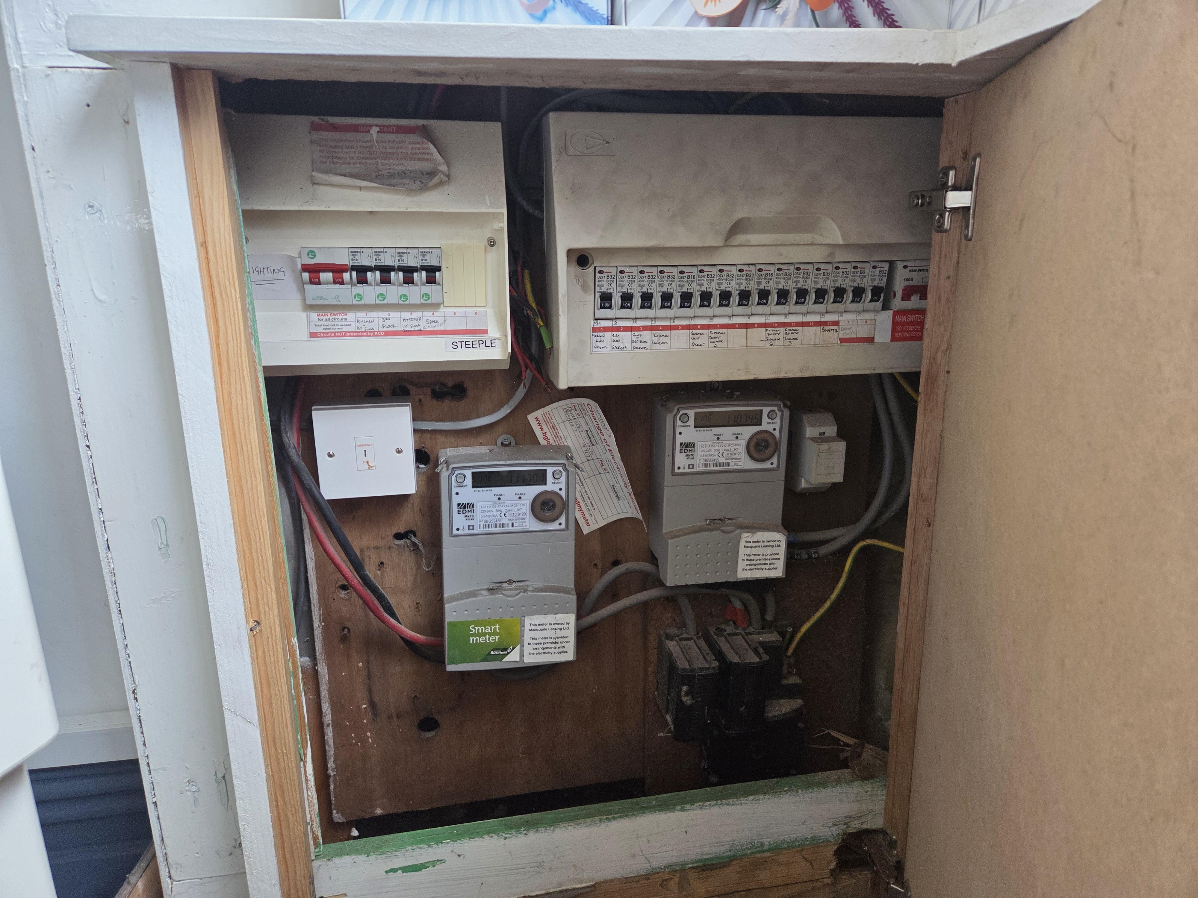 Dangerous old wooden fuse box requiring an 18th Edition consumer unit upgrade in Blackburn