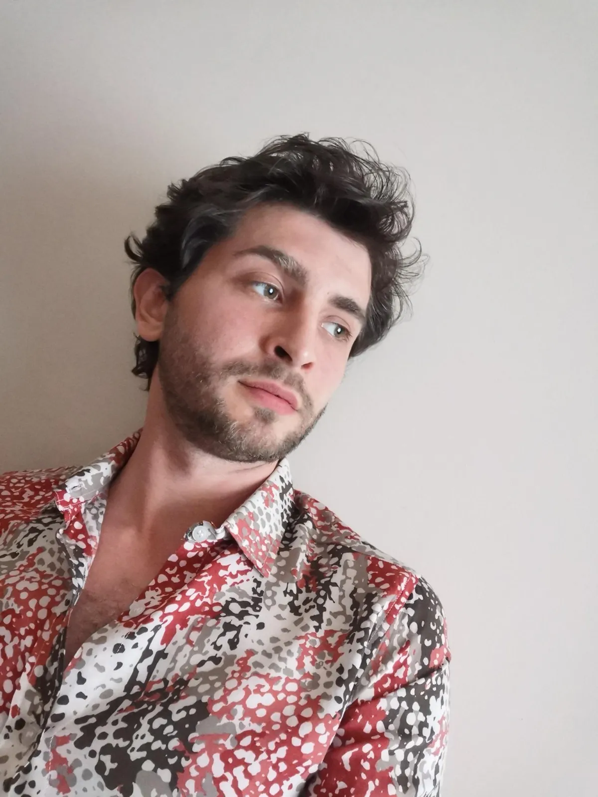 Black and white picture of Bogdan Jensen, the artist, painting a picture. 