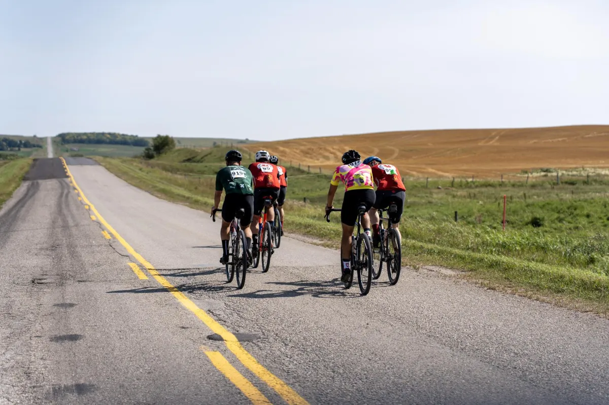 the sun is setting over a mountain range