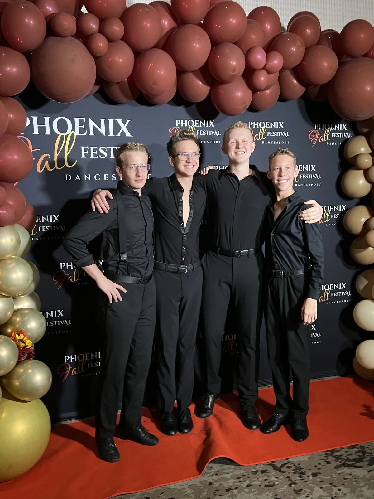 Phoenix Ballroom Academy male students posing together at a ballroom competition