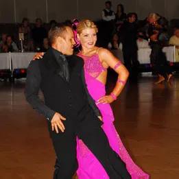 Ross Pearce dancing Foxtrot with his professional 9-Dance partner at a ballroom competition