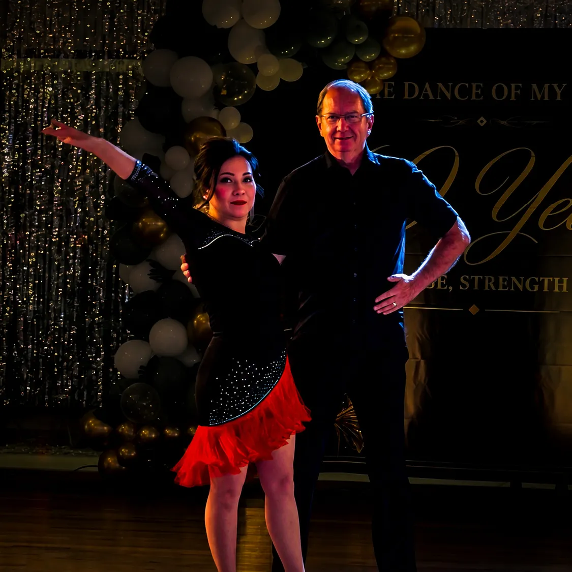 Adult ballroom students dancing together at The Phoenix Ballroom Academy in Chandler, Arizona