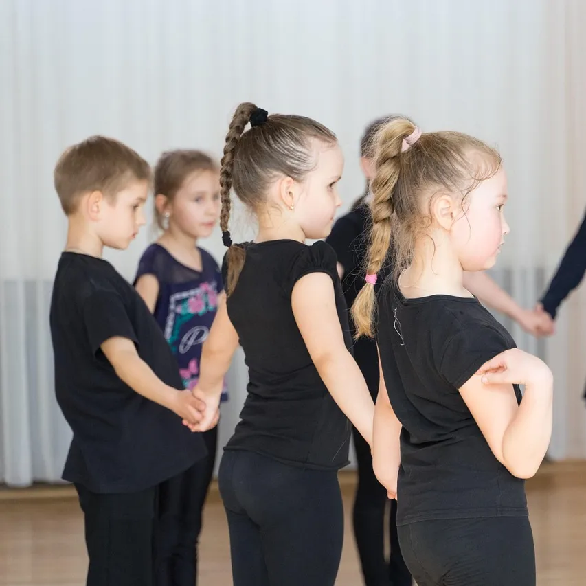 Children participating in a junior ballroom dance class