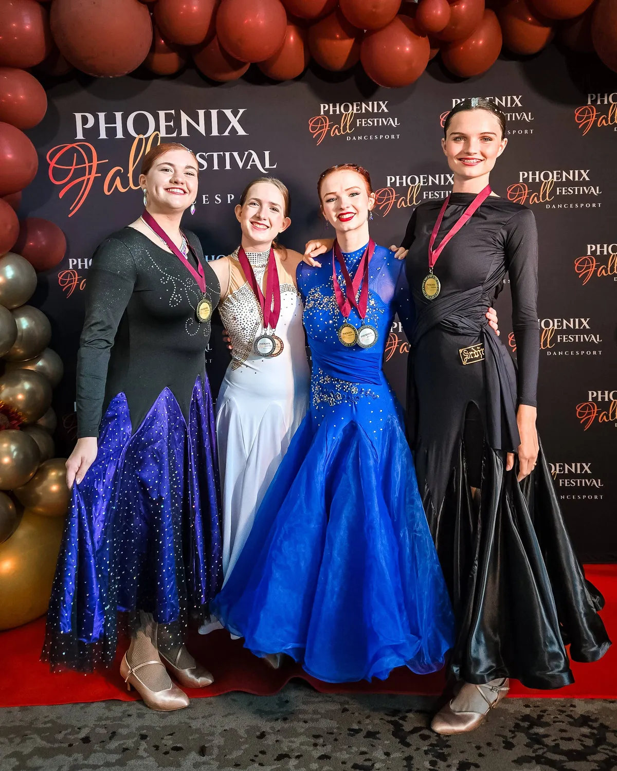 Phoenix Ballroom Academy students posing together at a ballroom competition