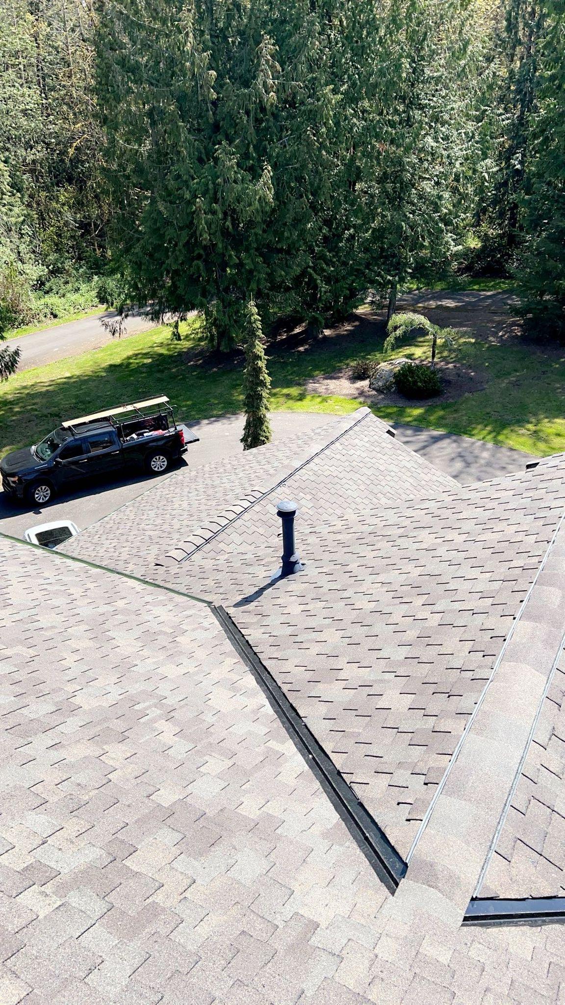 A roof with new asphalt shingles on it.