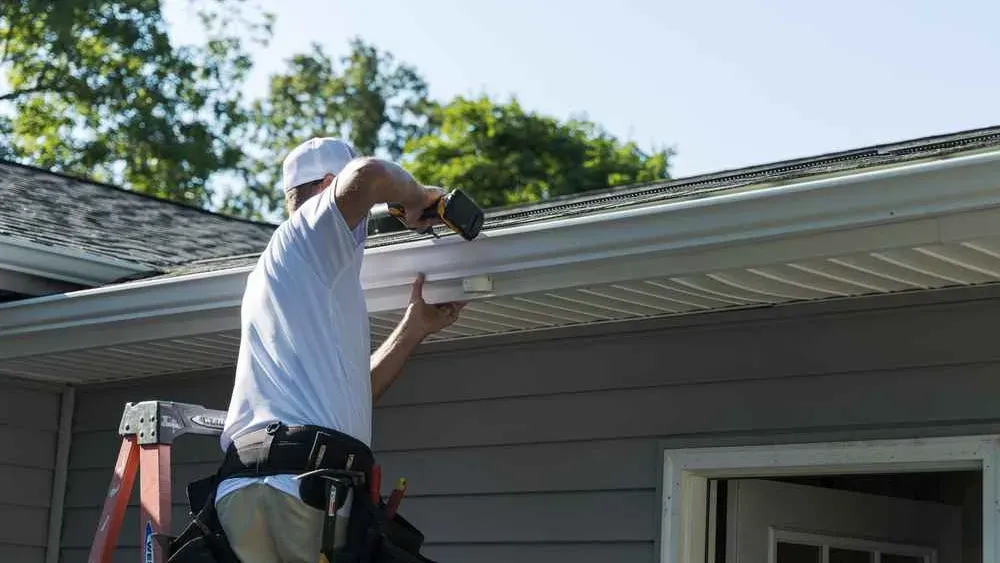 A house with new gutters being installed.