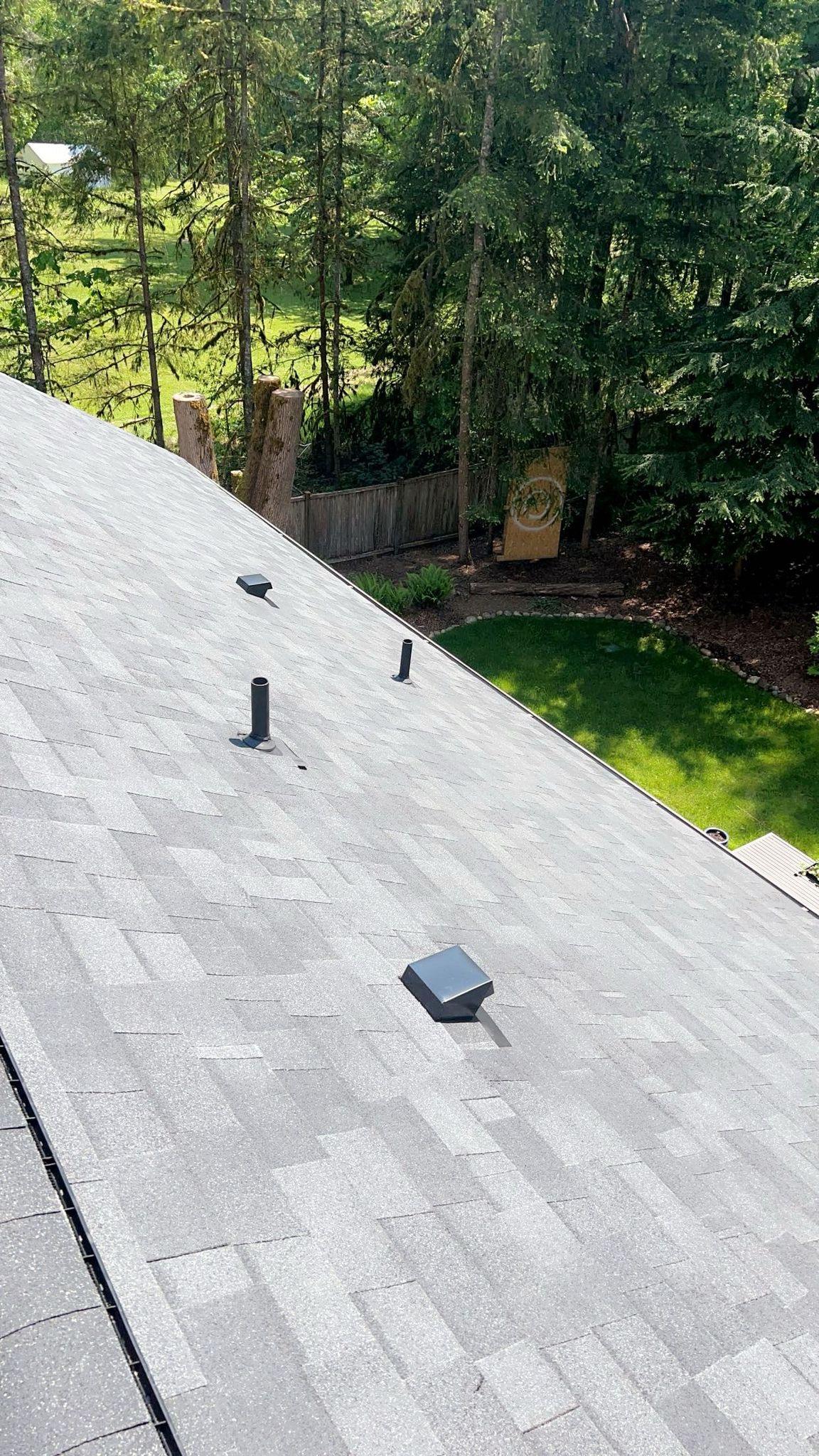 A house with new shingles on it.