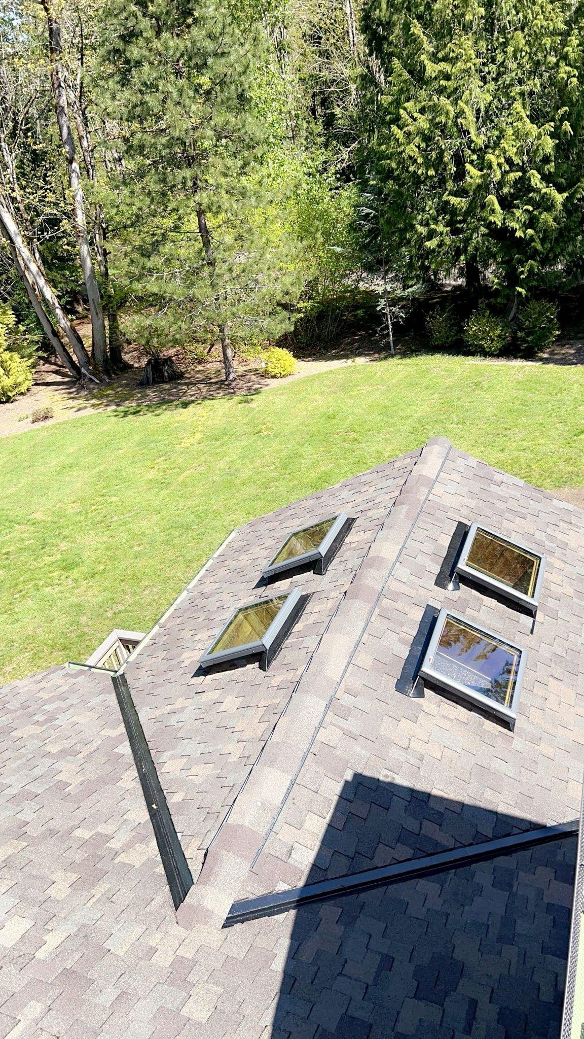 A house with new shingles on it.