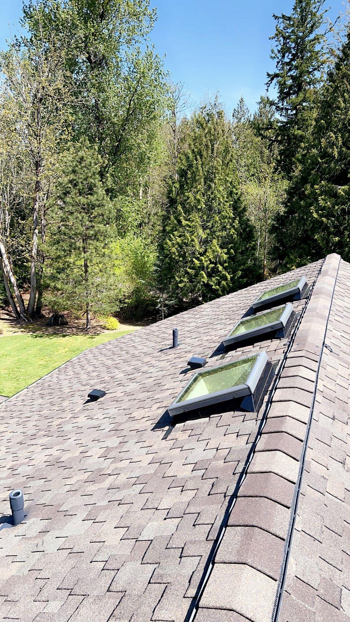 A house with new shingles on it.