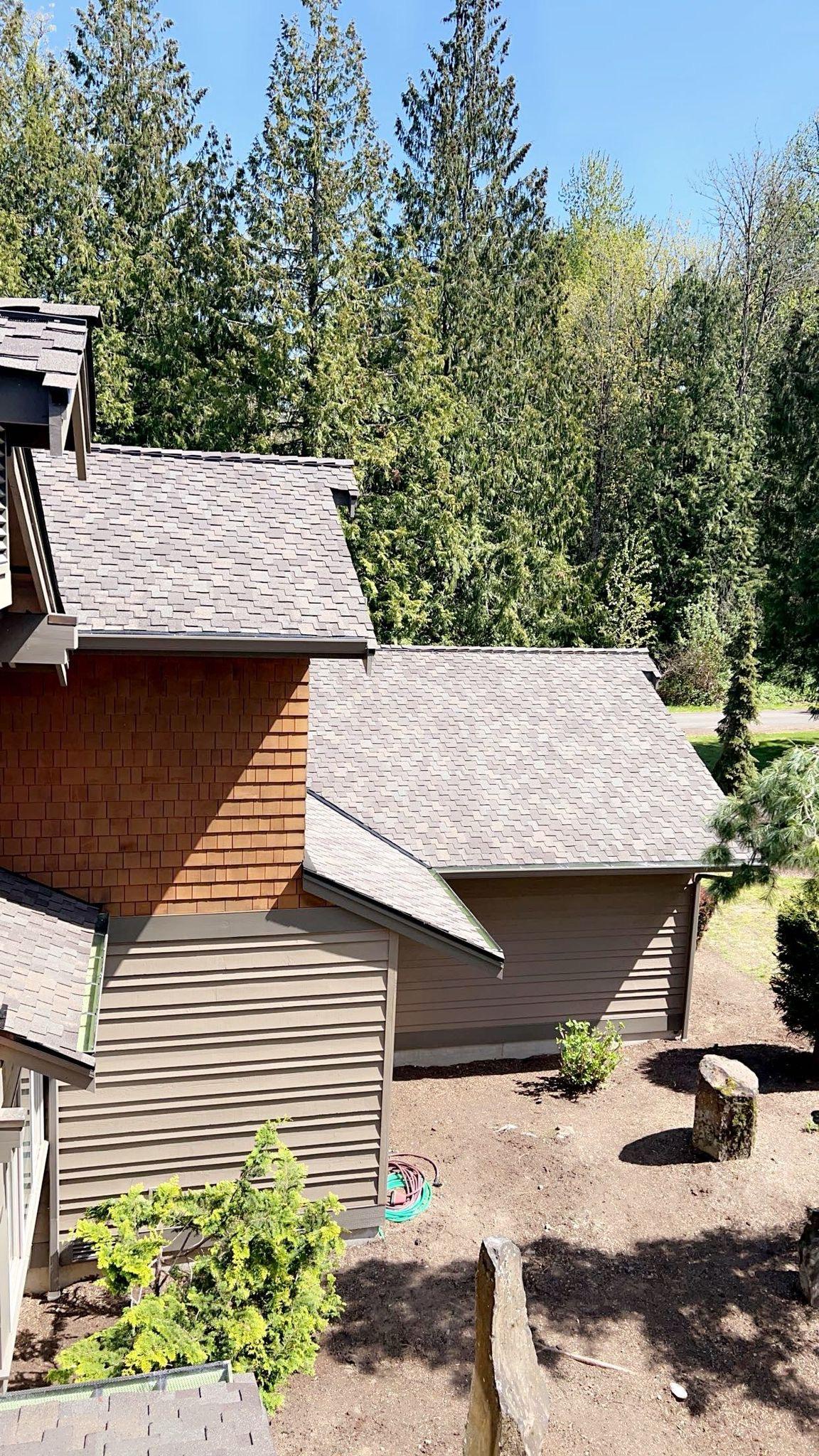 A roof with new asphalt shingles on it.