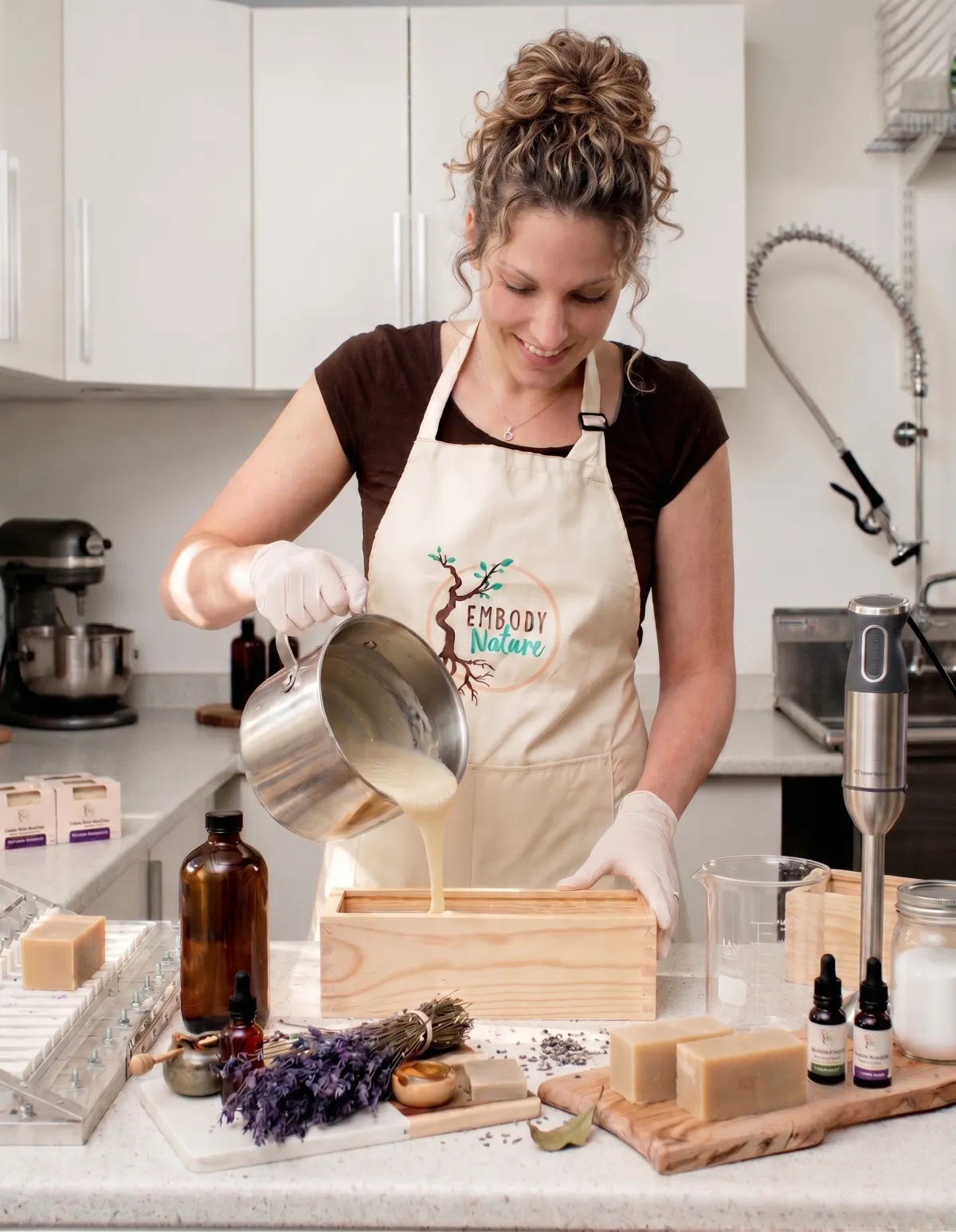 Kaele working with her hands in the studio