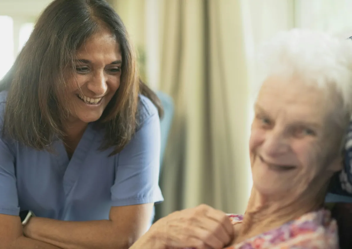 Caregiver providing compassionate home health care to a senior client