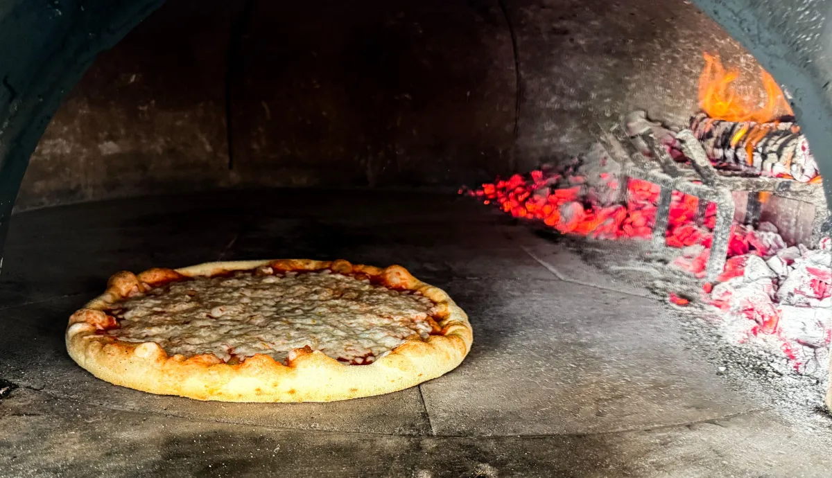pizza on brown wooden table