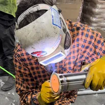 JI Industries - Welder welding a pipe spool