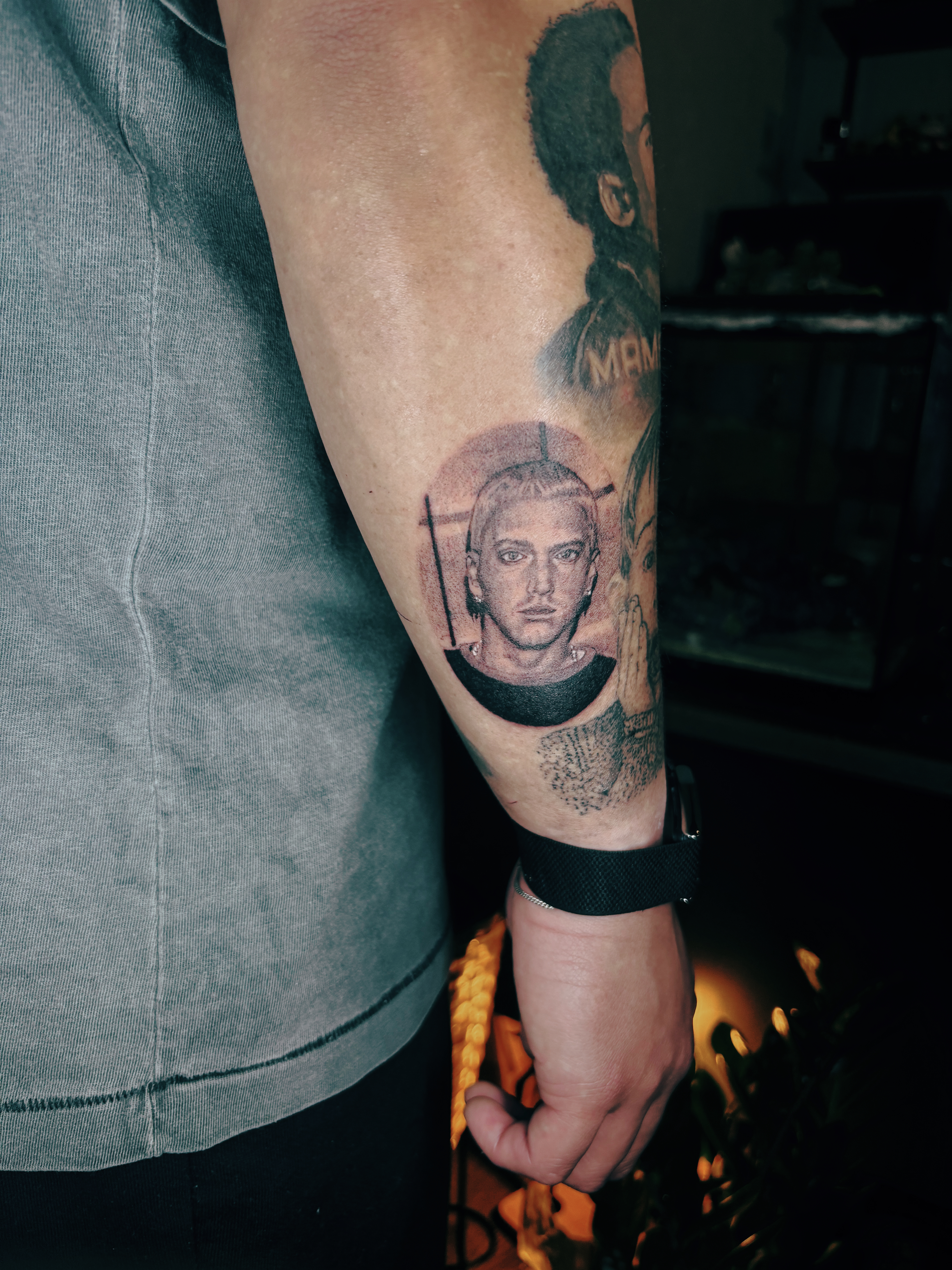 person with tattoo on right arm