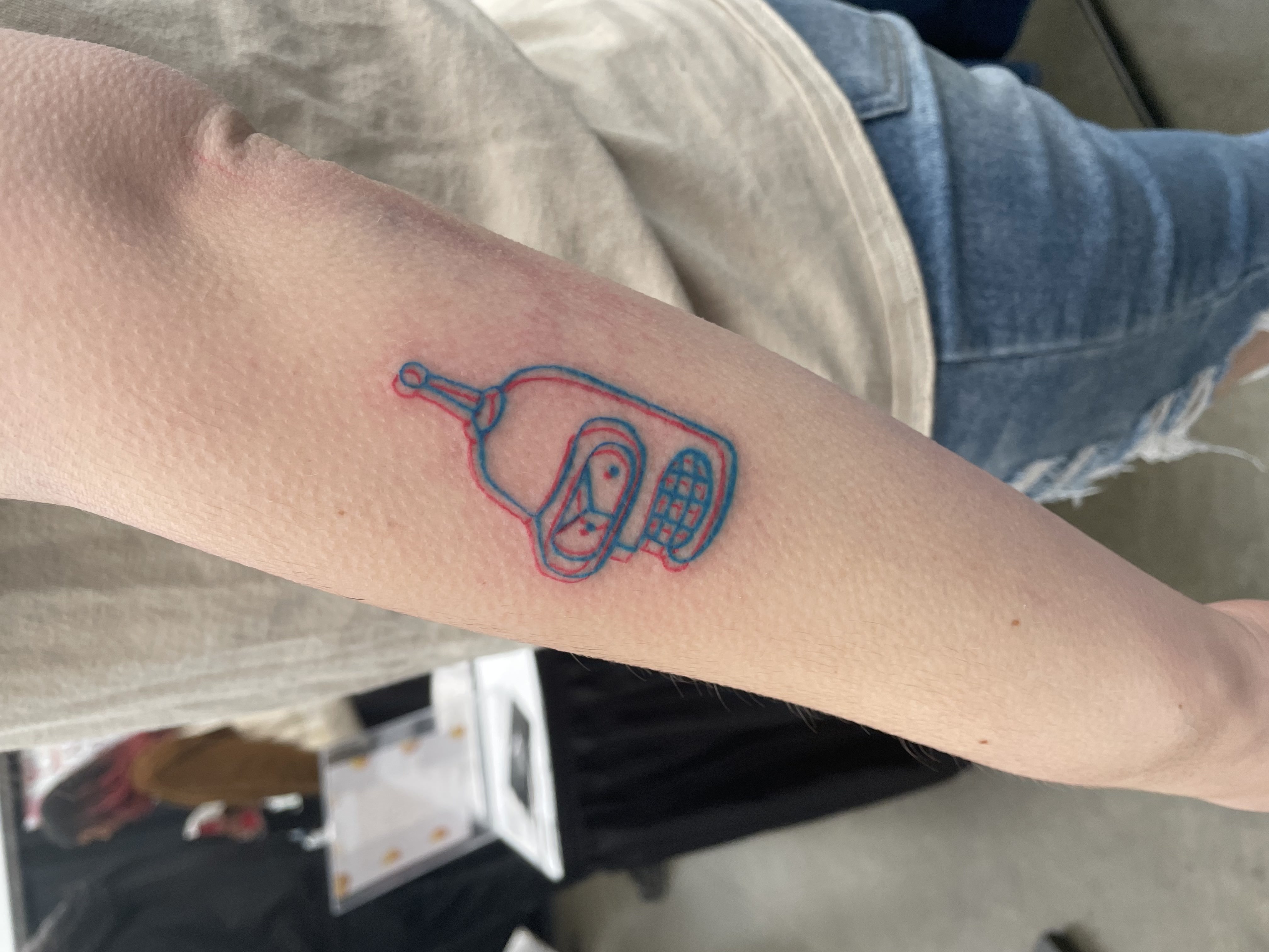 person in blue denim shorts and white nike sneakers standing on gray concrete floor